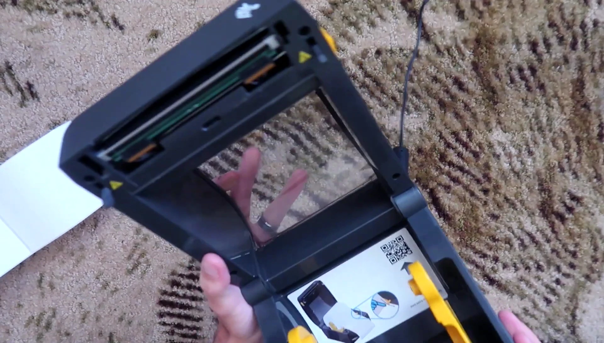 Interior view of the printer showing the thermal print head and label holder.
