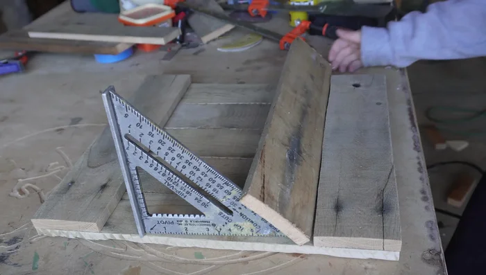 Assemble the mail slot by attaching the angled pieces to the main body with a brad nailer.