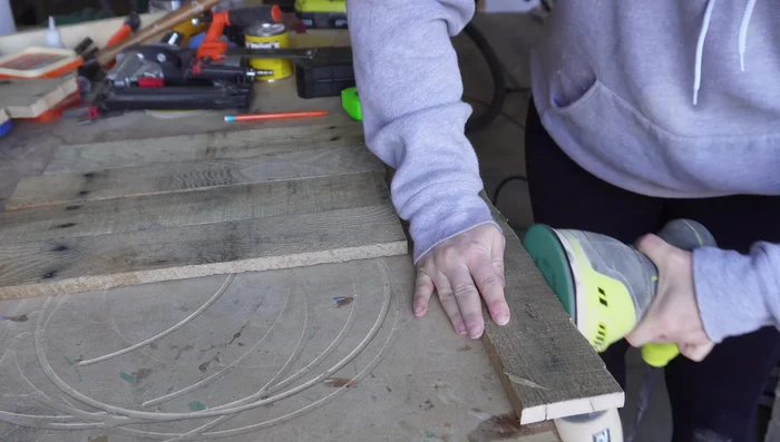 Sand the wood pieces to smooth out rough edges and splinters.