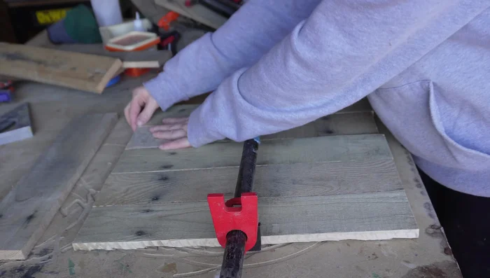 Clamp the pieces together and attach them using a brad nailer.