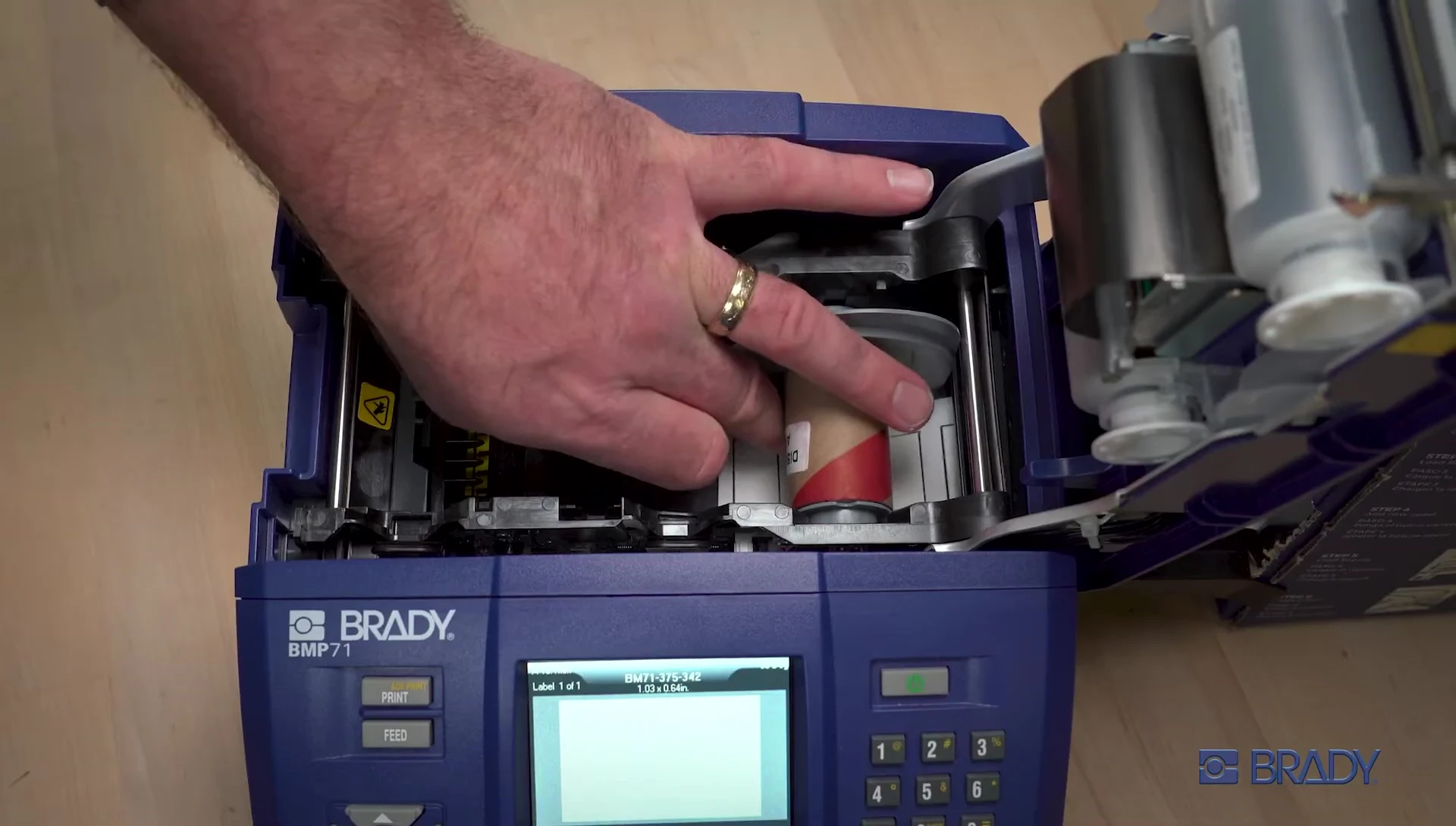 Feeding the labels through the material slot