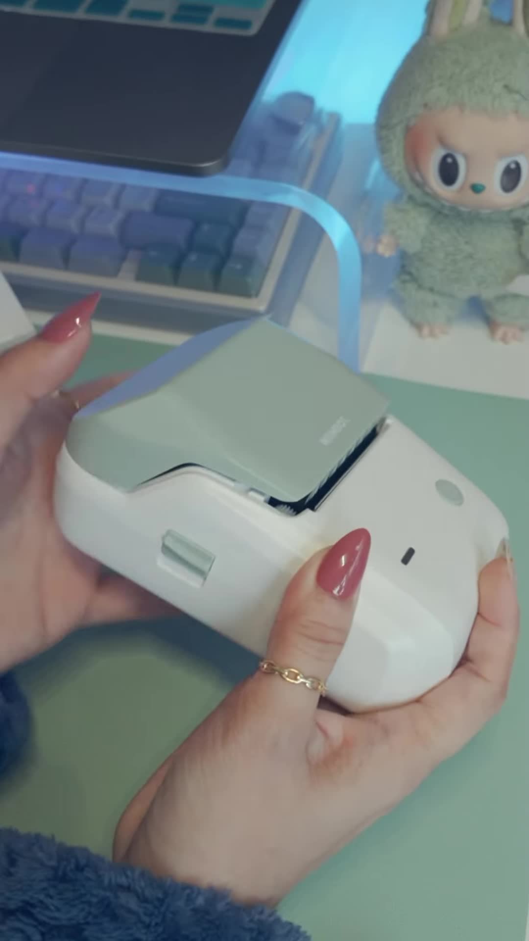 Close-up of the Niimbot B1 printer in its packaging.
