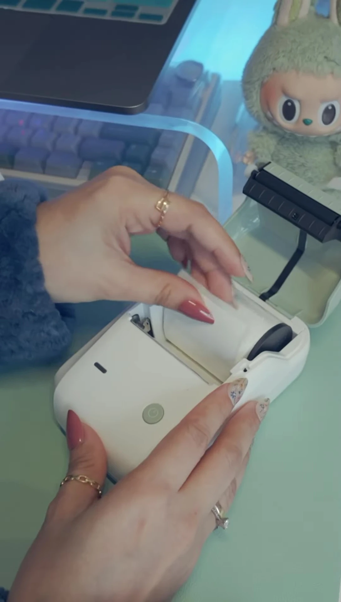 The Niimbot B1 printer shown again highlighting its compact design.