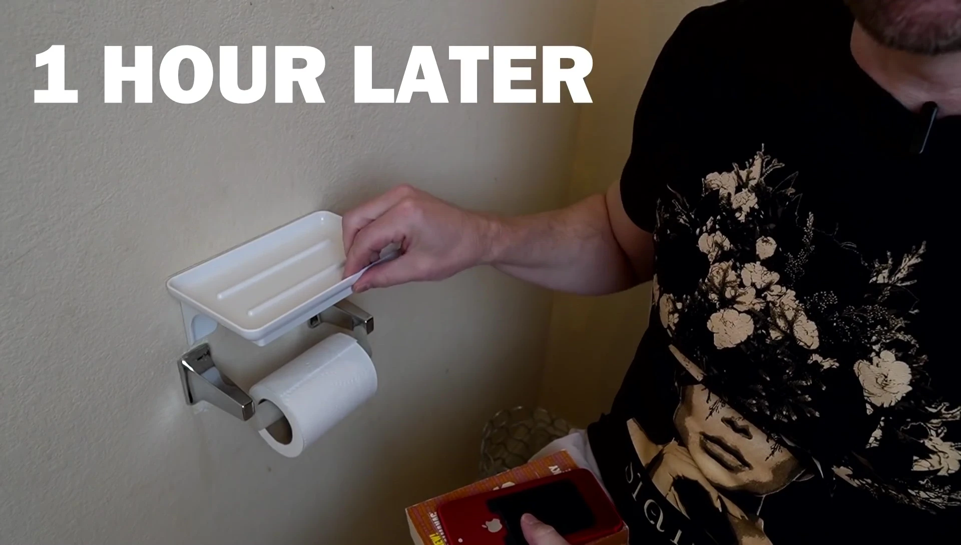 The reviewer showing the Wonder Shelf installed in the bathroom.