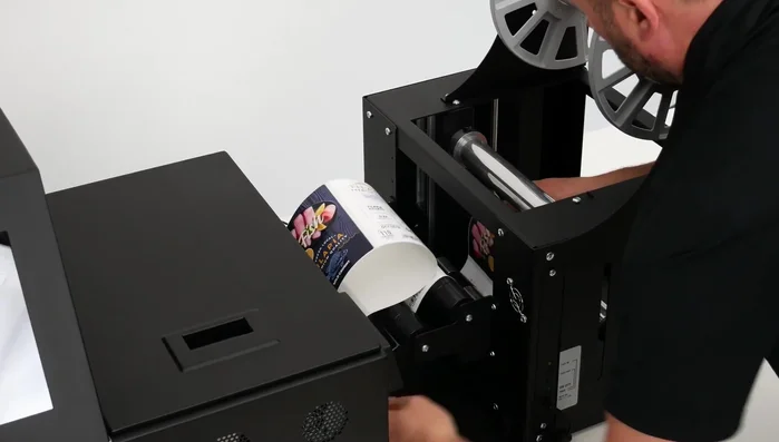 Attach the rewinder core and start the rewinder.