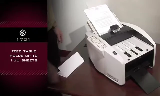 The machine in operation, highlighting its high-speed folding capability.